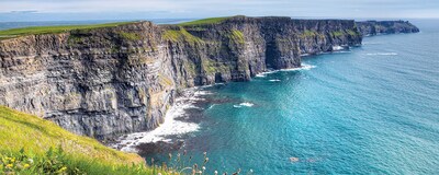 The Cliffs of Moher loom over the sea