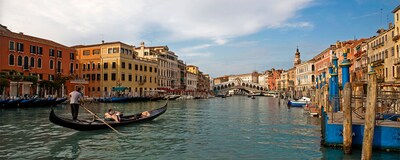 A gondola cruising along a canal in Venice, Italy