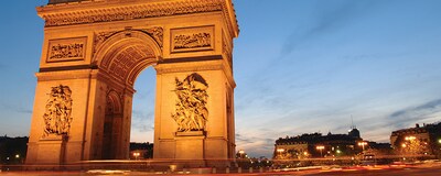 The Arc de Triomphe in Paris, France at night