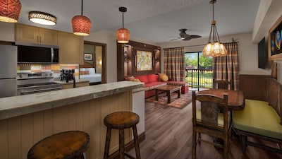 A 1 Bedroom Villa with a living area, kitchen and a balcony at Disney's Animal Kingdom Villas Kidani Village