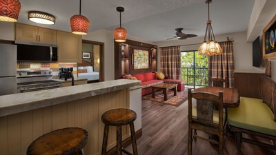A 1 Bedroom Villa with a living area, kitchen and a balcony at Disney's Animal Kingdom Villas Kidani Village