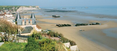 A hotel and other buildings on a beach on the French coast, near the D Day landing spot in Normandy