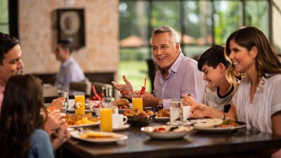 A multigenerational family enjoying breakfast at a restaurant