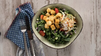 Chili Spiced Crispy Fried Tofu Bowl featuring crispy tofu, seasoned with chili spice and topped with a crunchy vegetable slaw, boba balls and sauce.  