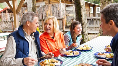 A family of 4 enjoying a traditional Alaskan meal