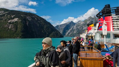 A group of Guests admiring the glacier views of Alaska from a Disney Cruise Line ship