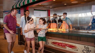 A family ordering pizza from a pizza venue aboard a Disney cruise ship