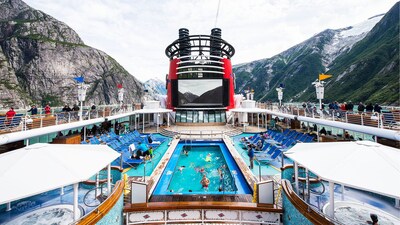 Goofy's Family Pool on the upper deck of the Disney Wonder as it sails through a fjord