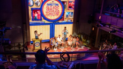Guests participating on stage in the Disney Cruise Line Family Time Game Show