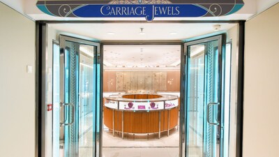 The entrance to Carriage Jewels reveals 2 open doors leading to a jewelry case filled with jewelry 