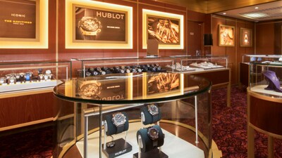 The interior of an upscale jewelry story reveals cases filled with watches and fine jewelry
