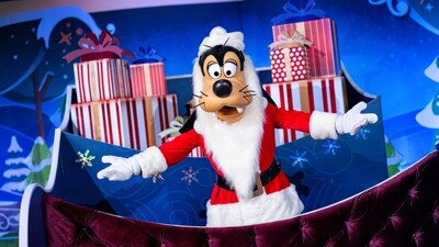 Goofy with a sled full of presents during Holidays at Walt Disney World Resort