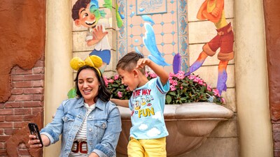 A mother and child taking a selfie in the Italy Pavilion at Epcot