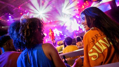 Two Guests enjoying a live music show at the Epcot International Flower and Garden Festival