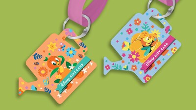 A pair of EPCOT International Flower & Garden Festival gift card lanyards shaped like watering cans
