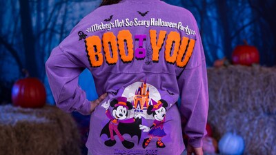 A sweatshirt featuring Mickey Mouse and Minnie Mouse in Halloween outfits and text that says ‘Boo to You’ from Mickey’s Not So Scary Halloween Party 2025