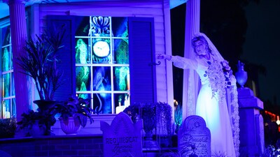 The bride from The Haunted Mansion posing during Madame Leota's Swinging Wake, A Haunted Mansion Street Party