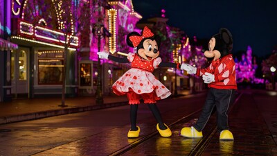 Minnie Mouse and Mickey Mouse dancing together on Main Street, USA in Disneyland Park