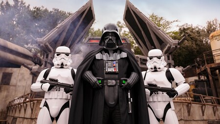 Darth Vader flanked by 2 stormtroopers in Star Wars Galaxy’s Edge at the Disneyland Resort.