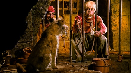 Dangling from a dog's mouth is the key that would free jailed pirates of the Caribbean