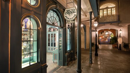 Fine crystal glassware sparkles in the evening while lining the window displays at Cristal d'Orleans