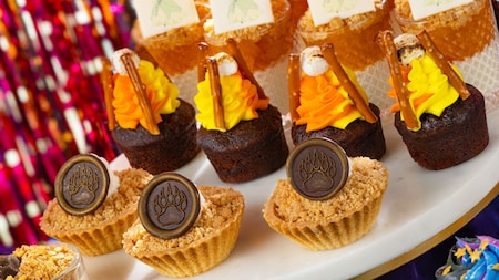 A platter of desserts including brownies, parfaits and crumble cups