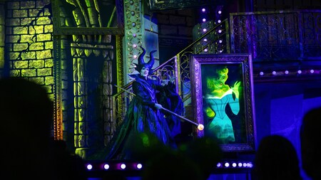 Maleficent standing on stage during Disney Villains: Unfairly Ever After