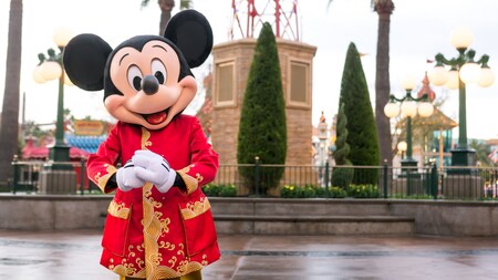 Mickey Mouse smiles while wearing a Lunar New Year inspired outfit.