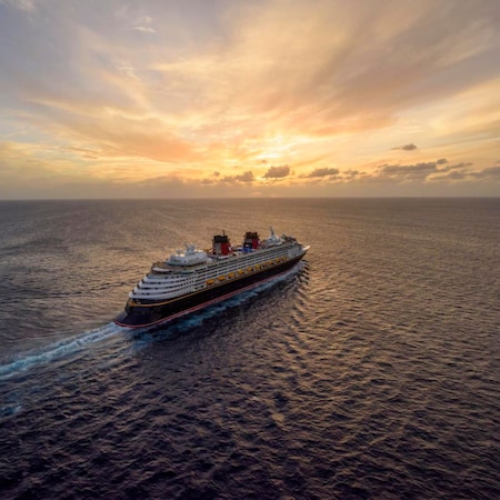 A Disney cruise ship sailing into the sunset