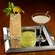Three specialty cocktails being served on a tray