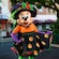 Minnie Mouse poses in formal Halloween attire in front of Hollywood and Vine