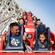 Guests hang on, riding Incredicoaster
