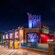 The exterior of WEB SLINGERS A Spider Man Adventure at night