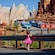 A little girl watches cars race at Radiator Springs Racers at Disney California Adventure Park