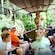 Aboard a Jungle Cruise boat with other Guests, a young princess points excitedly