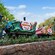 Casey Jr. Circus Train crosses a stone Storybook Land bridge