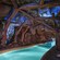 The creek flows through a huge cave supported by wooden beams