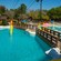 The thick cable of a zip line suspended over a pool at Fahrenheit Drops 