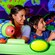 A mother and son aim space cannons during Buzz Lightyear's Space Ranger Spin