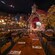Long communal dining tables across from a stage in Biergarten Restaurant in Germany Pavilion at EPCOT