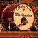 A drum set on stage with 'Oktoberfest Musikanten' written on the bass drum