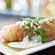 Battered quesadillas stuffed with mushrooms, corn, queso fresco, huitlacoche, topped with sour cream