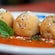 Three fried risotto balls filled with meat ragù and mozzarella