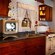 1950s-inspired kitchen with stove, cabinetry, countertop, TV set and 1950's knick-knacks