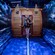2 Guests laughing as they exit a nautical themed challenge room surrounded by ocean wave murals