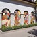 Artist Liz Flores and her mural honoring Women's History Month at Disney Springs Art Walk