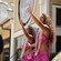 Two hula dancers in floral outfits performing outdoors at Disney Springs