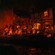 A scene from the Pirates of The Caribbean attraction featuring pirates engaged in different activities