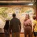A family of 4 looking at a Walt Disney World Resort map in the Walt Disney Presents gallery at Disney’s Hollywood Studios