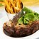 A plate of Steak Frites and a small salad from Be Our Guest